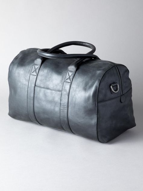 Explore in style with the Scarsdale Holdall in black.Crafted from premium natural leather, the holdall has been engineered for a rich, textured finish. With use it will develop a natural patina, so it will become even more uniquely yours over time: a mark of true quality.This leather holdall has been designed with comfort and durability at the forefront. The grab handles are padded so the bag can be carried with ease. The shoulder strap is fully adjustable and detachable with large, strong, clasp fittings to withstand the demands of everyday life. It is also lined throughout in a satin fabric. Leather Holdall, Fabric Strap, Natural Leather, Satin Fabric, Everyday Life, Patina, Shoulder Strap, Handles, Satin