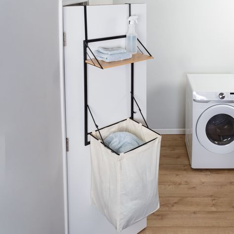 "Buy the Honey Can Do Black & Maple Collapsible Wall-Mounted Hamper with Laundry Bag & Shelf at Michaels. com. If you can’t score a basket throwing your dirty clothes at this laundry bag, the style and versatility are a win in itself. Get ready to put the 'fun\" in functional! If you can’t score a basket throwing your dirty clothes at this laundry bag, the style and versatility are a win in itself. A black powder-coated frame, detachable canvas bag, and wood shelf intertwine to create this timel Laundry Shelves, Laundry Solutions, Clothes Hamper, Bathroom Storage Organization, Doing Laundry, Folding Clothes, Wood Shelf, Space Saving Solutions, Laundry Hamper