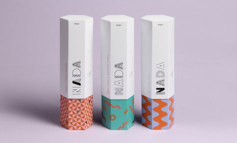 Created by two students, Thomas Squire and Eve Warren, Nada features geometric patterns in bold colors.  "Nada isn’t just a brand for healthy food, but a brand that communicates through fashion, beauty, well being and body confidence." Packing Inspiration, Hexagon Box, Cosmetics Packaging, Socks Packaging, Box Packaging Design, Student Project, Packing Design, Food Packaging Design, Tea Packaging