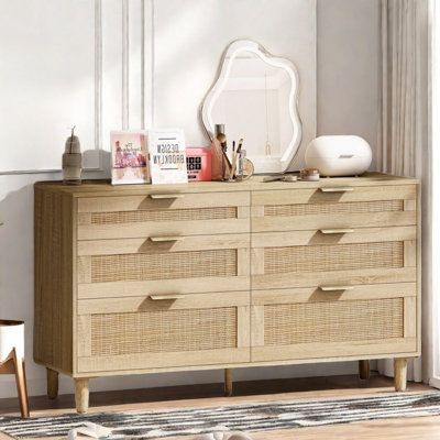 The six-drawer design gives this dresser a powerful storage function. Three different drawer sizes to meet your various items storage needs. Whether it is cosmetics, clothes or daily necessities, you can find the right drawer for sorting and storing to help you keep your room clean and orderly. The rattan drawer panel is a highlight of this dresser. The addition of rattan elements makes the whole dresser add rustic atmosphere, which complements the golden metal handle and shows a unique beauty. Rattan Dresser, Plants Pictures, Rattan Cabinet, Living Ro, Accent Chests And Cabinets, Wooden Dresser, Drawer Design, Wood Dresser, 6 Drawer Dresser