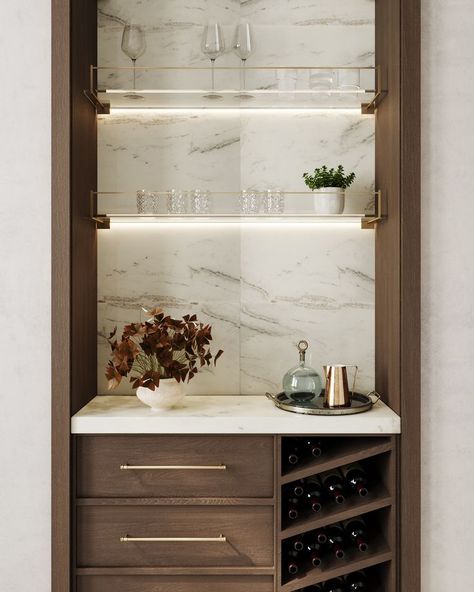 In-home dry bar design idea. Warm walnut cabinets and shelving with marble backsplash. Bar accessories such as wine and drinking glasses are in view. Bar has mini wine fridge beneath the counter. Built In Bar Cabinet, Dry Bar Ideas, Dining Room Built In, Bar Nook, Coin Bar, Home Bar Cabinet, Home Bar Rooms, Modern Home Bar, Marble Bar