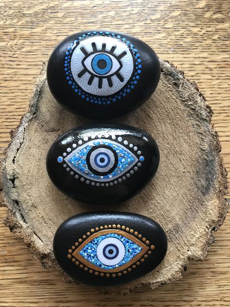 Evil Eye Painted Rocks, Evil Eye Rock Painting, Evil Eye Stone Painting, Eye Painted Rocks, What To Paint On Rocks, Chakra Rock Painting, Dragon Eye Rock Painting, Chakra Painted Rocks, Evil Eye Art