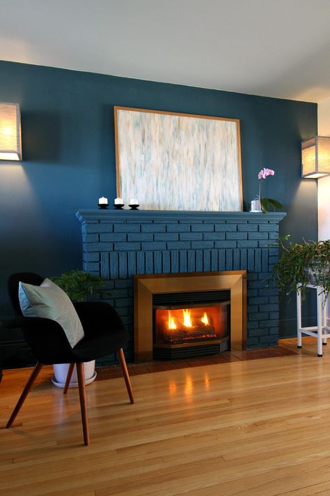 Bold Blue Painted Fireplace Makeover Using Chalk Paint. Looking for  colorful fireplace ideas? Check out this chalk painted fireplace makeover with Annie Sloan Chalk Paint in Aubusson Blue. This blue fireplace brick looks so cozy with the matching blue fireplace accent wall. Plus the blue fireplace wall  also helps hide the TV and disguise the fact that it's off-center. Click  through to see more of this painted fireplace brick before and after and my tips for DIY painted fireplace brick. Blue Fireplace, Aubusson Blue, Painted Fireplace, Grey Fireplace, Red Brick Fireplaces, Charcoal Walls, Painted Brick Fireplace, Painted Brick Fireplaces, Gas Fireplace Insert