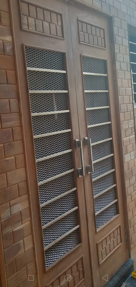 Jali Door Design Modern Dabal Door, Wooden Main Door Design Jali, Double Jali Door Design Modern Wooden, Double Door Net Design Wood, Wooden Door With Grill, Main Door Net Design, Jali Door Glass Design, Mesh Door Design Wooden Main Door, Main Door Jali Design Entrance Wooden