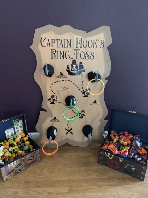 Pirate Trick Or Trunk Ideas, Pirate Hook Game, Trunk Or Treat Ideas For Cars Peter Pan, Captain Hook Ring Toss, Pirate Themed Trunk Or Treat Ideas, Pirate Ring Toss, Trunk Or Treat Peterpan, Trunk Or Treat Ideas For Cars Pirate, Pirate Trunk Or Treat Ideas For Trucks