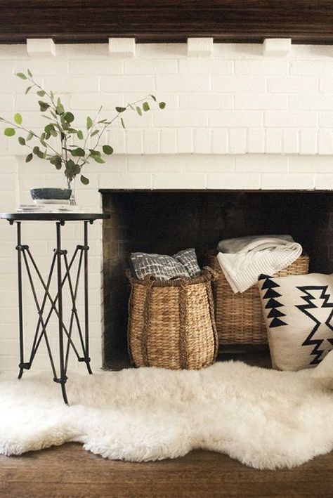 Baskets In Fireplace, Frameless Candles In Fireplace, Faux Fur Rug In Front Of Fireplace, Fireplace Dentil Molding, Baskets In Front Of Fireplace, Faux Fur Living Room Decor, Decorate In Front Of Fireplace, How To Decorate A Non Working Fireplace, How To Style Fireplace