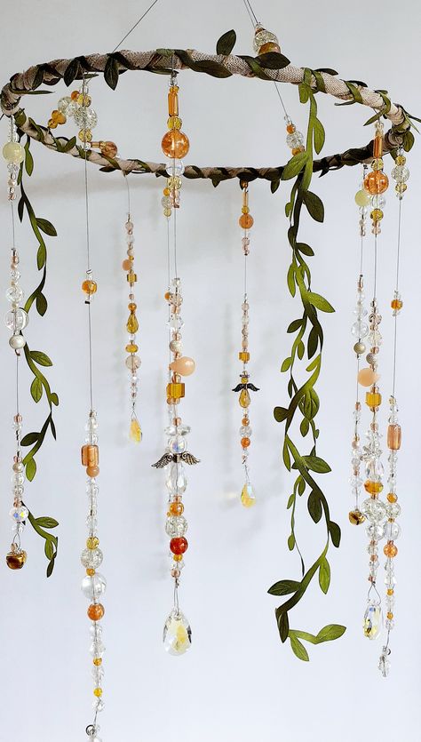 Our handmade one of a kind boho guardian angel mobiles are the perfect, one of a kind baby shower gift! Hand beaded using jewelry quality beads and crystals, each of our guardian angel mobiles has fairy garden vibes. Soothing angel shadows and ivy shadows are cast when hung near a nightlight. But during the day, color and sparkle are cast when the beautiful faceted glass beads and crystals catch the light! This listing is for 1 (one) large boho guardian angel mobile. Each is truly a one of a kin Fairy Core Shelves, Fairy Themed Gifts, Dream Catcher Mobile Nursery, Fairy Core Aesthetic Room Decor, Fairytale Decor Home, Fairy Core Decoration, Goblincore Bedroom Aesthetic, Butterfly Garden Nursery, Ren Faire Decor