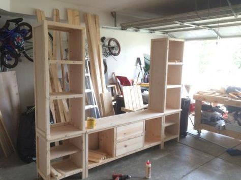 Diy Entertainment Center With Bookshelves, How To Build A Entertainment Center, Bookshelf Entertainment Center Diy, Large Wall Unit Entertainment Center, 2x4 Entertainment Center, Homemade Entertainment Center, Diy Bookshelf Entertainment Center, Diy Entertainment Center Ideas Easy, Diy Entertainment Center Plans