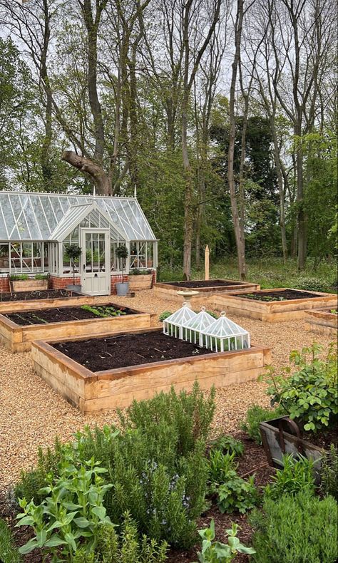 A gardeners dream with devine green house and planters White Green House Aesthetic, Garden Area With Greenhouse, Greenhouse Surrounded By Garden, Kitchen Garden With Greenhouse, Raised Bed Garden With Greenhouse, Green House In Garden, Beautiful Green Houses, Green House Asthetics, Green House Backyard