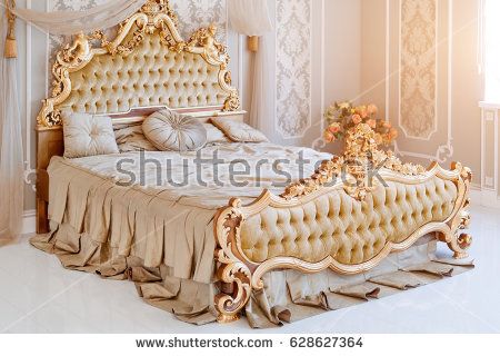 Luxury bedroom in light colors with golden furniture details. Big comfortable double royal bed in elegant classic interior Golden Bed, Luxury Bedroom Lighting, Wooden King Size Bed, Beautiful Bed Designs, Bedroom Ideas Luxury, Golden Furniture, Royal Bed, Design Ložnic, Luxury Bedroom Furniture