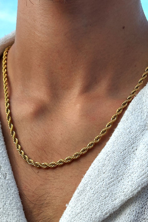 Picture showcasing a gold necklace for men in a twisted rope 2mm design. It's an exceptional piece of jewelry that catches the eye with its rich gold accent and unique structure. Specially designed for the modern man, it impeccably complements streetwear fashion, emanating an urban vibe that's impossible to ignore. Reflecting skillful craftsmanship, this necklace embodies the perfect fusion of traditional aesthetics and contemporary style. Men Gold Accessories, Gold Accessories For Men, Men’s Gold Necklace, Debs Suits, Necklace Design For Men, Chains For Men Gold, Men Necklace Gold, Mens Gold Necklace, Men Gold Chain