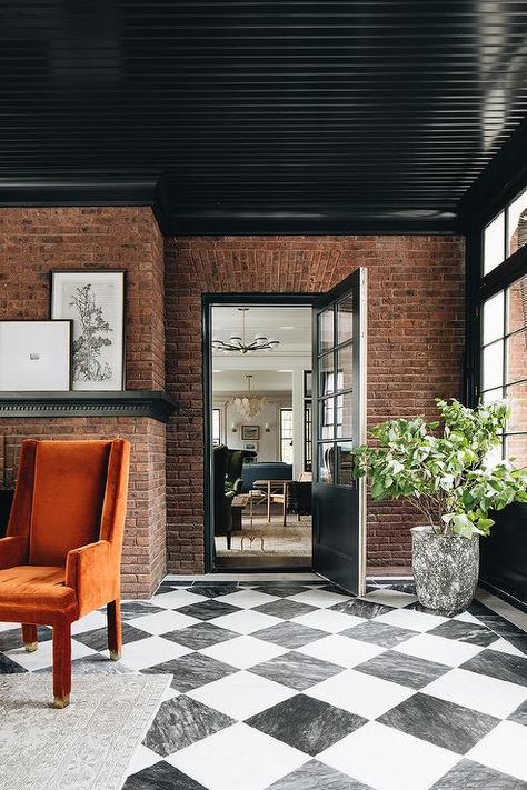 Black Sunroom, Brick Sunroom, Harlequin Floors, Jean Stoffer Design, Checkered Floor, Red Brick Wall, Brick Interior, Interior Windows, Black And White Tiles