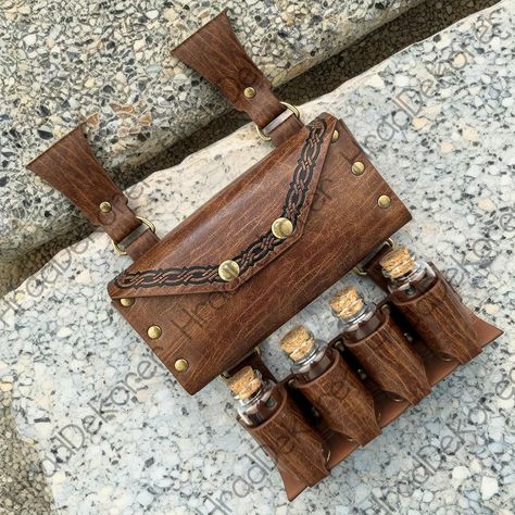 Leather Belt Potion Holder for 4Bottles - Ideal for Cosplay, Alchemists, Healers, Adventurers | Steampunk Accessory Package includes: 4*Glass Bottles + Alchemy Waist Bag ### 🏷️ Belt & Bag Details: - **Gender Unisex 👥 - **Material Leather 👜 - **Special Use Costumes 🎭 - **Source Type Historical ⏳ - **Item Type Accessories 🎩 ### 📦 Order Processing Timeframe: We allocate 1 to 3 business days to carefully handle and prepare your order with the utmost attention to detail. ⏳ 🛍Global shipping 7-2 Steampunk Herbalist, Alchemist Belt, Alchemist Costume, Potion Holder, Steampunk Backpack, Fan Holder, Steampunk Witch, Steampunk Bag, Pirate Cosplay