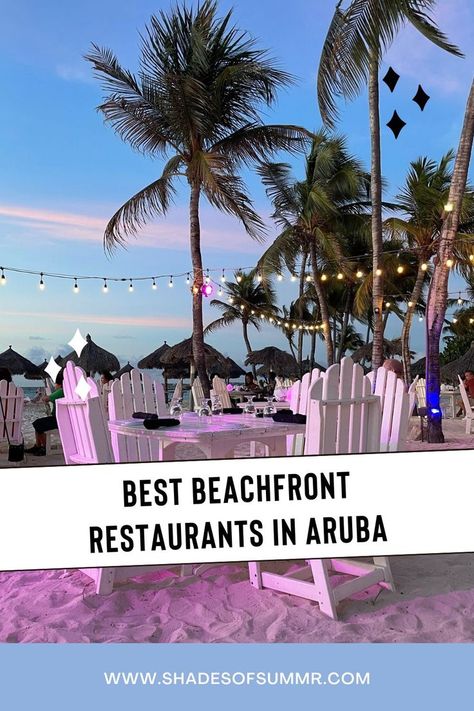 A picture of a white table in the sand with chairs, fairy lights and palm trees at sunset with text saying best beachfront restaurants in Aruba Aruba Pictures, Aruba Food, Aruba Restaurants, Aruba Honeymoon, Palm Beach Aruba, Sunset Restaurant, Aruba Beach, Aruba Travel, Caribbean Travel