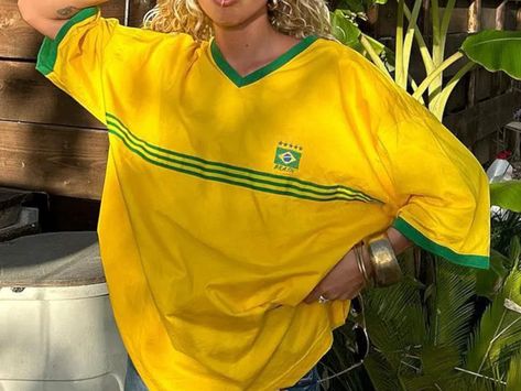 🌞 Embrace summer vibes with our Women's Brazil Embroidery Yellow T-shirt! This casual, oversized tee is perfect for beach days or lounging in comfort. 🏖️ Crafted for a loose fit with medium to long sleeves and an O-neck collar, it combines casual style with Brazilian embroidery details. Pair it with shorts or jeans for a laid-back yet stylish look that's perfect for any occasion. 🌼✨ Brazil Tshirt Outfits, Brazil Outfits, Yellow Tshirt, Geometric Clothing, Y2k Top, Tops Graphic, Tshirt Women, Y2k Clothing, Yellow T Shirt