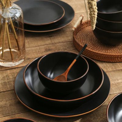 Make a statement with your casual dining ware with the Stone + Lain Brasa dinnerware set. Made in Stoneware and available in several colors–all with brown-edged borders–this rustic-chic combination perfectly accentuates a modern farmhouse style. With service for four, this 32-piece set includes eight 7.76-inch salad plates, eight 10.75-inch dinner plates, eight 33.8fl. oz. pasta plates, and eight 25 fl. oz. round bowls. Stone Lain Color: Black | Stone Lain Brasa 32-Piece Dinnerware Set Stoneware Dishes Sets Modern, Black Dishes Table Setting, Stone Dishes, Coffee Set Design, Dish Sets Dinnerware, Black Dinner Plates, Green Dinnerware Set, Stone Plates, Black Dinnerware Set