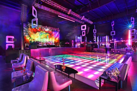 Guests danced on a colorful, light-up dance floor. Dance Party Decorations, Light Up Dance Floor, 70s Party Theme, 70s Theme Party, Studio 54 Party, 70's Party, Disco Decorations, 80's Party, Nightclub Design