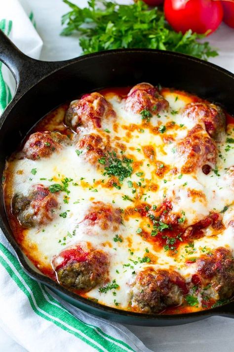 This meatball bake recipe is homemade meatballs, broiled to perfection and smothered in tomato sauce and melted cheese. A quick and easy dinner option that's sure to please the whole family! Meatballs With Provolone Cheese, Cheesy Meatball Skillet, Baked Meatballs With Mozzarella, Cheesy Meatball Bake, Skillet Meatballs In Marinara, One Pan Meatballs, Meatball Skillet Recipes, Cheesy Meatball Casserole, Meatball Parmigiana