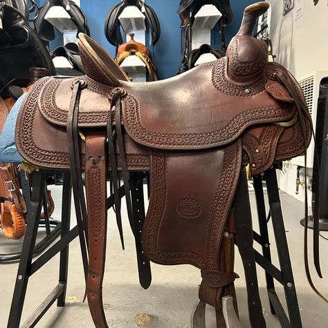 ✨ Just Arrived! ✨ Great all around ranch saddle! This 16” Billy Cook Saddle was made in Sulpher, OK, and is of exceptional quality. Model 2183. Designed with a 16” hard seat, heavy oiled leather with a hand-stamped running W border. Brass Hardware with 7/8 flat plate rigging. 28” skirt. Built on the standard Billy Cook Rawhide wrapped tree with estimated full QH Bars and a 7” gullet. It comes with a matching wide rear cinch and Classic Equine stirrups. $1,800 +tax Billy Cook Saddles, Ranch Saddle, Classic Equine, Stirrups, 1 800, Brass Hardware, Hand Stamped, Saddle, Equestrian