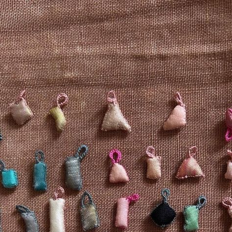 Antonia  Rossi on Instagram: "Enjoy everyday .  Tiny amulets colors of the earth  #amulets #talisman #love #protection #embroideryart #bijouxcreateur #textilejewellery #charms #assemblage #textiledesign #slowstitching" Collar Hippie, Ceramic Bead Jewelry, Assemblage Jewelry, Textile Jewelry, Slow Stitching, Sewing Art, Embroidery Inspiration, Bead Jewellery, Fabric Jewelry