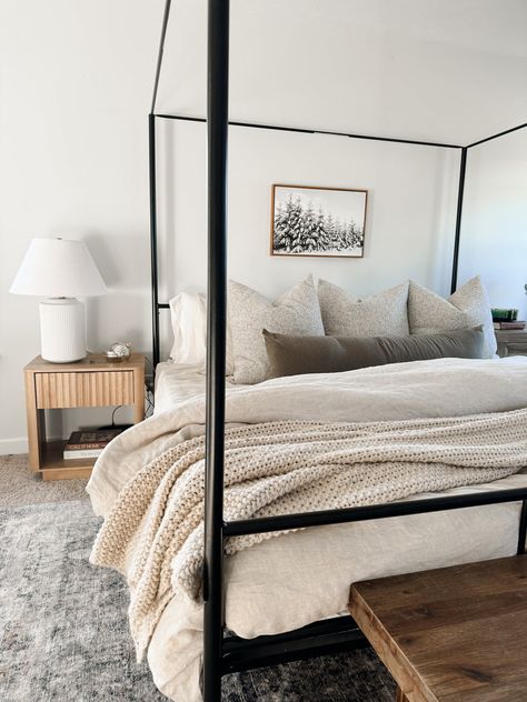 Bed With Body Pillow Decor, Guest Bed Inspiration, How To Decorate King Bed With Pillows, Earthy Bedroom Black Bed Frame, Cozy Neutral Bed, Rustic Canopy Bed, Pillow Styling Bed, Neutral Bed Styling, Beige Room With Black Accents