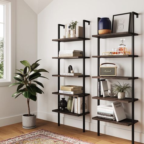 PRICES MAY VARY. The Theo Industrial Ladder Shelf is built with a durable metal frame and oak-laminate reclaimed wood for a vintage look. This 5-tier bookcase has a minimalist style that can fit your home office or living room. Stable bookshelves can carry 50 lbs. per shelf. Put multiple bookcases together to create a multifunctional space that fits your need. 25-minute assembly and lifetime manufacturer warranty: try for 100 days. Ladder Tv Unit, Wood And Metal Shelves Living Room, Modern Industrial Book Shelf, B&m Shelves, Industrial Shelving With Tv, Shelf With Leaning Frames, Concrete Shelves Living Room, Ladder Tv Unit Living Rooms, Floating Bookshelves Over Tv