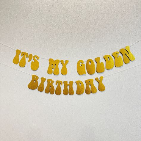 "Prepare to be delighted, this customizable It's My Golden Birthday banner is the perfect addition to your party decor!  ---OPTIONS--- > It's My Golden Birthday: Will include the phrase \"IT'S MY GOLDEN BIRTHDAY\".  Measures approximately 4' long and is adjustable by sliding the items on the string. > Custom Sign (with number of letters): Will contain your custom message only. Please be sure to write a personalization with the message you would like.  --- DETAILS --- > Made with card stock paper. > Each letters is 5\" tall and most letters are approximately 3\" wide. > All banners are pre-strung on a thin cotton string. > All letters are not attached to the string so they can slide to adjust the size/look of the banner. Looking for more birthday options? Click here: https://www.etsy.com/sh 26 Golden Birthday Party Ideas, Golden Birthday Birthday Cake, Golden Birthday Party Ideas For Adults, Golden 30th Birthday Ideas, Golden Birthday Aesthetic, Golden Birthday Ideas Kids, Kids Golden Birthday Ideas, Golden Birthday Ideas For Women, Golden Year Birthday Ideas