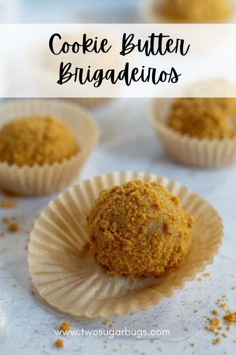 Cookie Butter Brigadeiros in cases on a grey background.