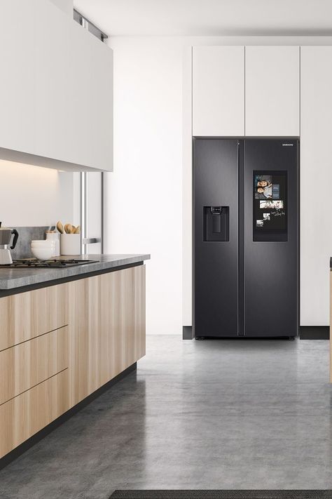 A 2-door, black Samsung Family Hub Refrigerator balances a white kitchen with natural wood cabinets and dark countertops. Black Fridge Kitchen, Fridge In Kitchen, Family Hub Refrigerator, Black Fridge, Black Fridges, Stylish Kitchen Design, Black Refrigerator, Tiny Kitchen Design, Family Hub