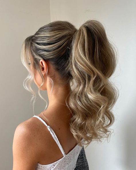 RACHEL JONES | Calgary Bridal Hair & Educator on Instagram: "POWER PONY 2024 INSPO 🫶🏻  This was a Big request last season not only for bridesmaids but also other stylists!   Truly one of my favorite styles to create for a gorgeous summer wedding   We were able to add lots of height AND a veil 😍  A fundamental with this styles is overall teasing… and I’m not necessarily referring to the pony 🫣  The W H O L E head will have texture, product and volume->   So it W I L L last all night long 🙌🏻  Would you wear this style to a wedding?" Bridesmaid Power Pony, Updo Hair Styles For Wedding, Bridal Pony With Hair Piece, Ponytail Bridal Hair With Veil, Low Pony Hoco Hairstyles, Bridesmaid Party Pony, Bridal Power Pony, Slick Back Pony Wedding Hair, Pony Hairstyles For Medium Hair