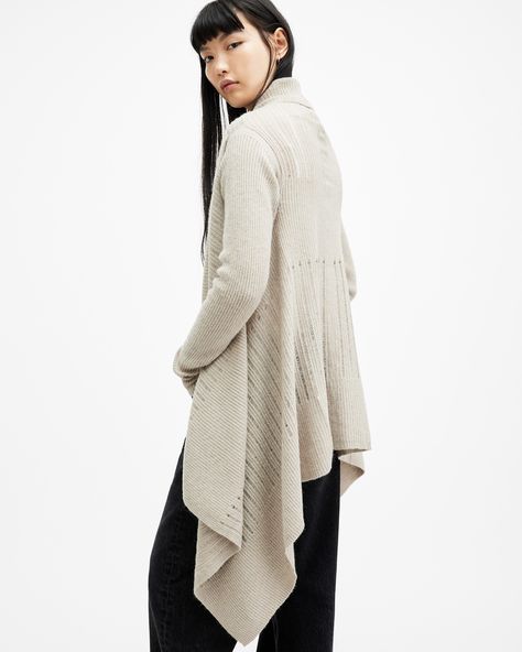 Layer with ease. The Harley is a lightweight cardigan made from a soft wool blend yarn with a fluffy texture. It's constructed with a distinctive edge to edge structure that falls in a waterfall shape with a shawl collar. The ladder stitch is mixed with solid ribbing to enhance the textural appearance. Complete with skinny sleeves to add balance to the silhouette.   Open front Long sleeve Shawl collar Edge to edge construction Open ladder stitch Ribbed texture Lightweight Sleeve Shawl, Ladder Stitch, Lightweight Cardigan, Open Front Cardigan, Soft Wool, Shawl Collar, All Saints, Front Open, Women Clothes Sale