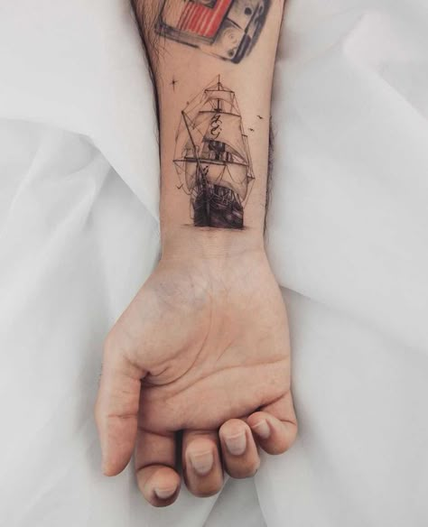 This article contains 60 fully original, distinctive, and eye-catching ship tattoo ideas. Bonus: all meanings explained. Pirate Tattoo Simple, Ship Tattoo Ideas, Pirate Ship Tattoo, Instagram Tattoos, Old Ship, Pirate Tattoo, Palm Tattoos, Clever Tattoos, Tattoo Inspiration Men