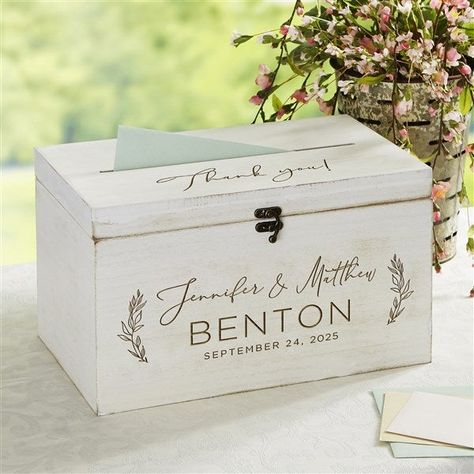 * Front of box is engraved with couples names, last name and 1 line message * Top of box is engraved with 1 line message  * Features latch lock to keep box closed * Opening on box lid allows for guests to easily deposit their greeting card * Felt lined interior * Measures 8 L X 13.5 W X 8 H * Holds approx. 60-100 cards * Constructed of MDF whitewash wood * Wipe clean * Imported Our Elegant Couple Engraved Wooden Wedding Keepsake Card Box is the perfect gift for any couple or bride-to-be. Their special day will be a day to remember with this keepsake box. Advice Box Wedding, Wedding Advice Box, Advice Box, Wedding Luncheon, Elegant Couple, Card Box Wedding, Cute Wedding Ideas, A Day To Remember, Wooden Wedding