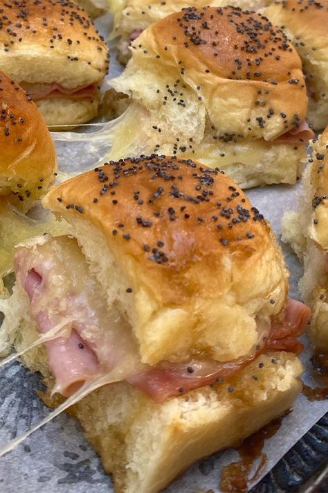 Looking for lunch ideas or dinner ideas? Try cooking these funeral sandwiches. Use ham, Swiss cheese, Hawaiian rolls, and poppy seeds to cook these Hawaiian roll sliders for an appetizer, snack, football food, or Superbowl party food. Gawain Roll Sandwiches, Dollar Roll Sandwiches, Hawaiian Bun Sandwiches, Hawian Roll Sandwiches, Hawaiian Bread Rolls, Hawaiian Roll Sandwiches, Roll Sliders, Sliders Recipes, Recipes Sandwiches