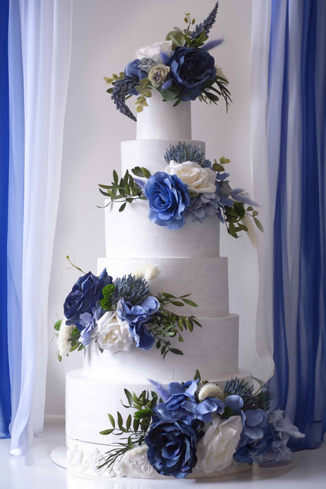 Enhance your wedding cake with our Stunning Royal & Dark Blue Floral Cake Topper Set. This impressive 4-piece floral arrangement is designed to elevate your cake with striking dark and royal blue tones, perfect for adding sophistication and style to any wedding or special occasion. Crafted from high-quality artificial flowers, this set offers a luxurious look that will captivate your guests and complement a wide range of wedding themes, from classic and elegant to bold and modern. Royal Blue Wedding Cake Ideas, White And Navy Wedding Cake, Royal Blue And White Wedding Cake, Sapphire Wedding Theme, Cake With Blue Flowers, Royal Blue Wedding Cake, Blue Floral Cake, Navy Blue Wedding Cake, Ocean Wedding Cake