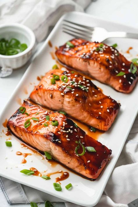 Three fillets of Teriyaki Salmon, beautifully seared with a golden exterior, glazed in a sweet and savory teriyaki sauce, making it a go-to recipe for a fast and flavorful dinner. Teriyaki Fish Recipes, Teriyaki Salmon Recipes, Terriyaki Salmon, Salmon With Teriyaki Sauce, Teriyaki Fish, Salmon Steak Recipes, Teriyaki Glazed Salmon, Salmon Fillet Recipes, Salmon Teriyaki