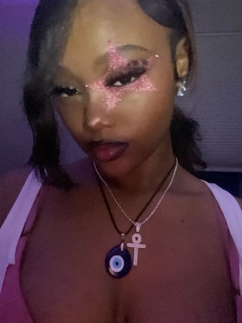 Star makeup glitter pink y2k pink punk black girl makeup black girl alt makeup glitter pink Makeup Looks To Do When Bored, Makeup Ideas Extra, Makeup Ideas Rave, Star On Cheek Makeup, Trashy Eye Makeup, Lifted Look Makeup, Pink Out Makeup Football Game, Y2k Rave Makeup, Hello Kitty Makeup Tutorial