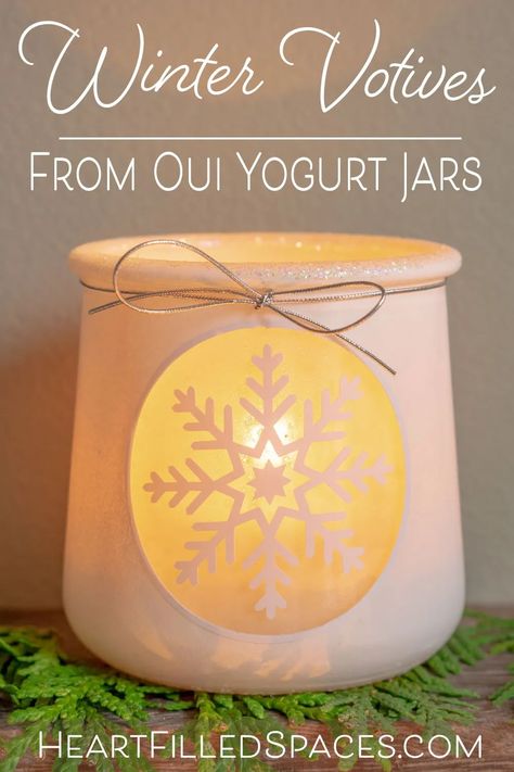 This cute little votive craft idea will add some warmth and fun to your home this winter. Reuse those glass yogurt jars and make something special this holiday season. Includes step by step instructions with free printables/cut files. #holidaycrafts #diy #votives #jar #oui #wintercrafts #upcycle Oui Jars Repurpose Christmas, Oui Crafts, Oui Yogurt Jars Ideas, Recycled Garden Crafts, Oui Jars, Oui Yogurt, Yogurt Jars, Crafts With Glass Jars, Snowflake Craft