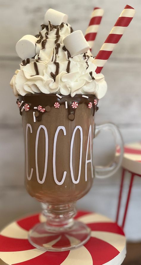 "Fake hot cocoa, comes with fake chocolate drizzles and sprinkles,  comes in a glass mug.  This elegant drink is sure to add to your Christmas decor. Would also add a great touch to Christmas photos. Approximately 8.5-9\" tall. This hot cocoa is hand made so may very *not for consumption *not a toy * Displays not included" Hot Chocolate Christmas Decor, Fake Hot Chocolate Mugs, Fake Hot Cocoa Mug, Diy Fake Hot Cocoa Mugs, Fake Hot Cocoa Prop Diy, Faux Hot Chocolate Mugs, Hot Cocoa Christmas Decor, Fake Hot Chocolate Prop Diy, Faux Hot Cocoa Mugs