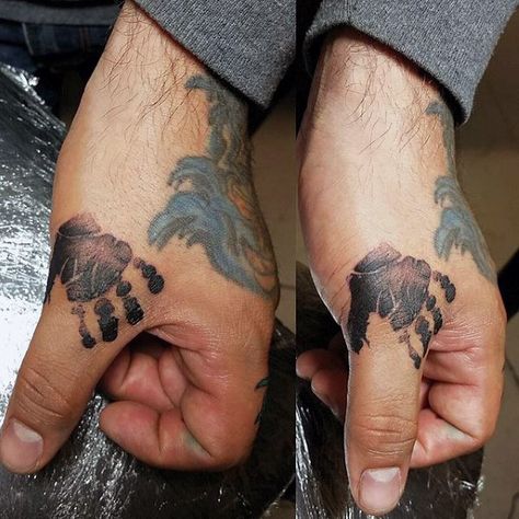 Man With Handprint Tattoo On Thumbs Baby Hand Print Tattoo, Handprint Tattoo, Baby Hand Tattoo, Hand Print Tattoos, Newborn Tattoo, Tattoos For Baby Boy, Baby Tattoo Designs, Father Tattoos