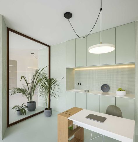 Pastel Green Palette, Minimalist Reception Area, Minimalist Reception, Doctor Office Design, Calm Environment, Curved Desk, Medical Office Design, Office Interior Design Modern, Cabinet Medical