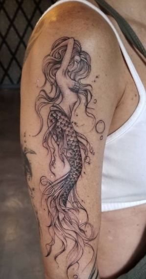 Back Of Arm Mermaid Tattoo Women, Girly Mermaid Tattoos, Mermaid With Waves Tattoo, Wrap Around Mermaid Tattoo, Large Siren Tattoo, Rosevine Tattoo, Mermaid Woman Tattoo, Peacock Mermaid Tattoo, Amphrite Goddess Tattoo