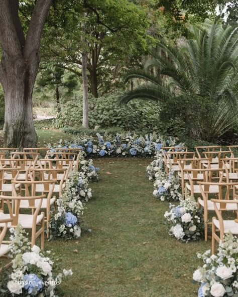 Wedding Aisle Decoration Ideas For Every Season Classic Wedding Aisle Decor, Dusty Blue Wedding Altar, Florals On The Ground Wedding, Wedding Aisle Decorations Winter, Flowers On Poles Wedding, Ceremony Aisle Chair Decor, Aisle Flowers Outdoor Wedding, Outside Aisle Decor, Outdoor Aisle Flowers