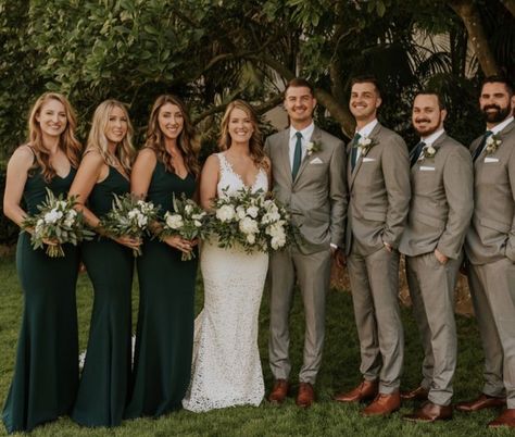 Grey And Green Tux Wedding, Grey Tux With Emerald Green, Dusty Green Bridesmaid Dresses With Groomsmen, Groomsmen Emerald Green Attire, Green Tie Wedding Groomsmen, Botanical Wedding Bridesmaid Dresses, Boho Wedding Emerald Green, Wedding Party Attire Green, Dark Grey Suit Green Tie Wedding