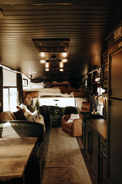 This moody RV interior includes a preserved moss wall (and you can rent it!). Renovation by @_gray_co_ // Photos by @cassnealeighphoto Black And White Backsplash, Small Travel Trailer, Faux Brick Backsplash, Preserved Moss Wall, Rv Interior Design, Black Interiors, Rv Interior Remodel, Camper Interior Design, Camper Trailer Remodel