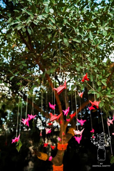 Pretty origami birds décor hanging from a tree | WedMeGood| #wedmegood #indianweddings #origami #birds #decor #hangingdecor #tree #treedecor #DIYDecor #colourful Reusable Wedding Decor, Jas Wedding, Mehendi Bridal, Origami Tattoo, Origami Cranes, Origami Rose, Paper Origami, Origami Bird, Goth Wedding