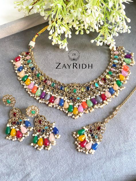 Beautify your look with the all-new multi-colour necklace set. The necklace set is designed with stunning embellishments to match any colour outfit. The Indian design and the premium material make a perfect combination to suit any formal dress. About this Necklace Set - Perfect for special wedding events or Asian cultural events - The glamor of this necklace set is timless - You can pair it up with any traditional ethnic attire - The premium material keep it same even after many uses Multi Colour Necklace, Indian Bridal Necklace, Indian Artificial Jewellery, Indian Hair Accessories, Colour Outfit, Multi Coloured Necklaces, Necklace Set Indian, Bridal Necklace Set, Indian Necklace