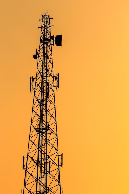 Photo silhouette of communication tower ... | Premium Photo #Freepik #photo #cell-tower #mobile-tower #telecommunication-tower #network-tower Cell Tower Drawing, Network Aesthetic, Tower Climber, Mobile Tower, Communication Tower, Street Background, Diwali Photography, Cell Phone Signal, Sunset Time