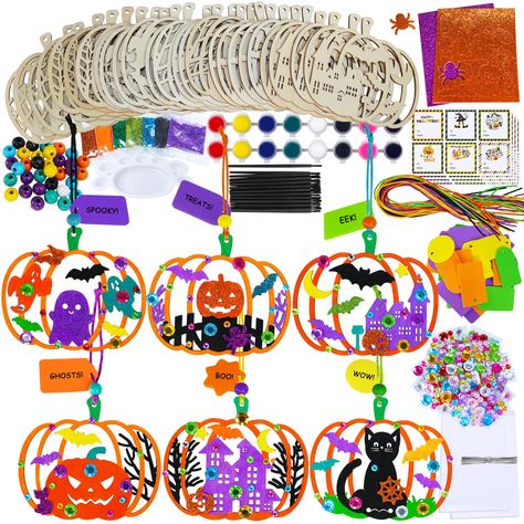 PRICES MAY VARY. Complete Craft Kit: Dive into the Halloween season with Halloween craft kit, perfect for creating 24 wooden pumpkin ornaments. This pumpkin crafts set includes 24 unfinished wooden pumpkin shapes, 2 set of acrylic paints, 24 paintbrushes, 1 palette, 7 glitters, 24 Halloween-themed glitter foam stickers, 24 gem stickers, 24 cords, 24 wooden beads, 24 treat bags, 24 twist ties, and 24 gift tags. Ideal for family crafting, school projects, and Halloween party decorations. Playful D Diy Halloween Activities, Cool Pumpkin Designs, Halloween Craft Kits, Halloween Pumpkin Crafts, Pumpkin Cutouts, Pumpkin Ornaments, Pumpkin Craft, Wooden Pumpkins, Wood Pumpkins