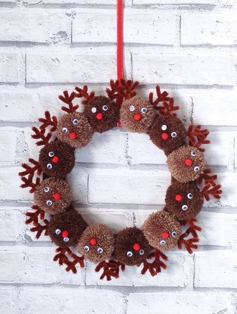 Handmade Christmas reindeer pom pom wreath | Etsy Yarn Reindeer Ornaments, Reindeer Pom Pom Craft, Xmas Pom Pom Wreath, Reindeer Wreath Ideas, Rudolph Pom Pom Wreath, Reindeer Pom Pom Wreath, Pom Pom Snowman Wreath, Kids Reindeer Crafts, Diy Pom Pom Christmas Decorations